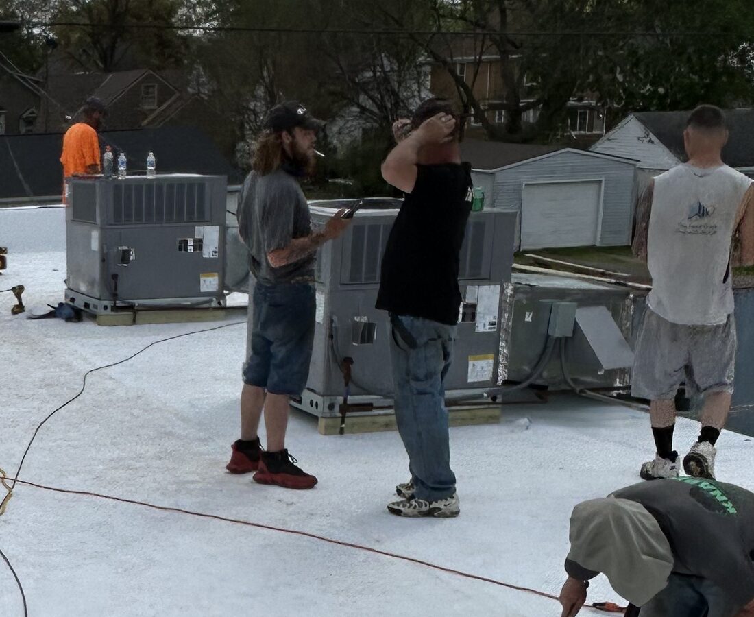 Crew working a commercial flat roof
